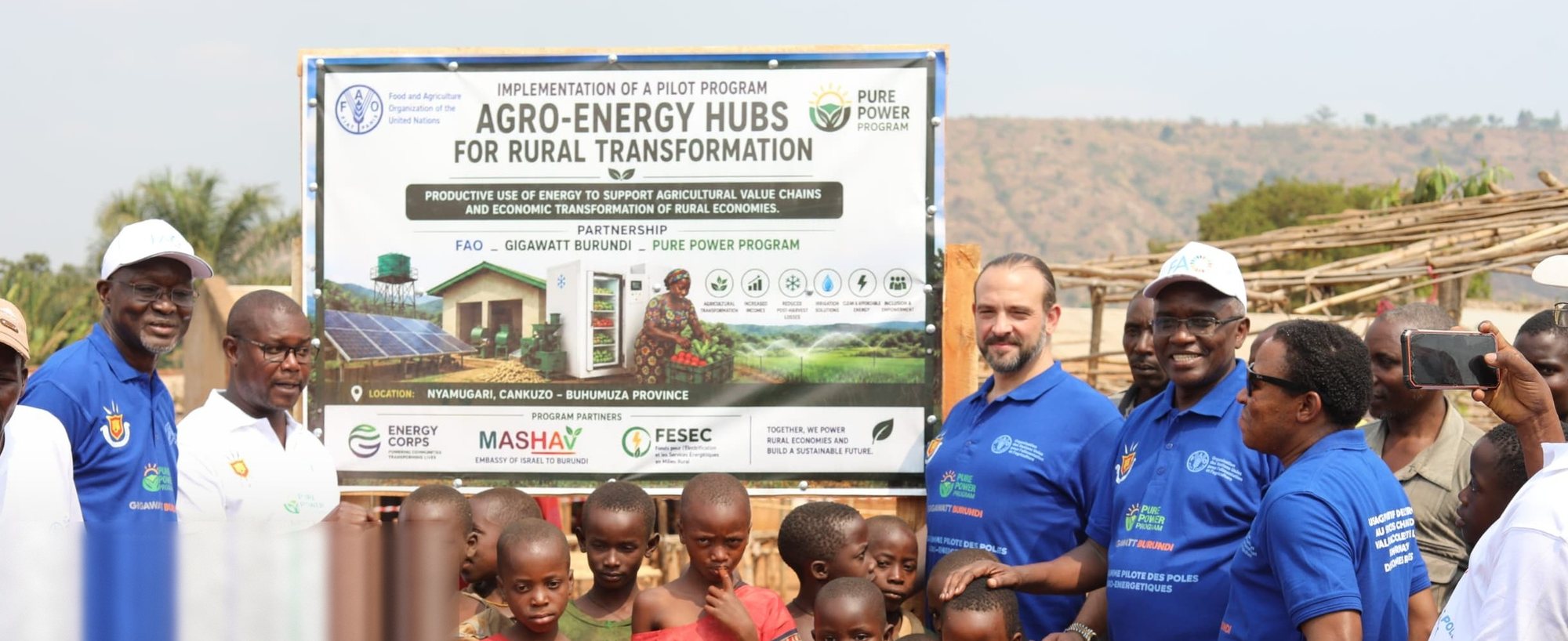 Groundbreaking of the first agro-energy hub at Nyamugari, Cankuzo, Burundi, 4 August 2026, with FAO and community members gathered at the project banner.